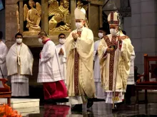 Cardinal Jose Advincula of Manila (right) is led to his cathedra inside the 
Manila Cathedral by Archbishop Charles Brown, papal nuncio to the 
Philippines, during the cardinal's installation as new prelate of the 
Archdiocese of Manila on June 24, 2021.